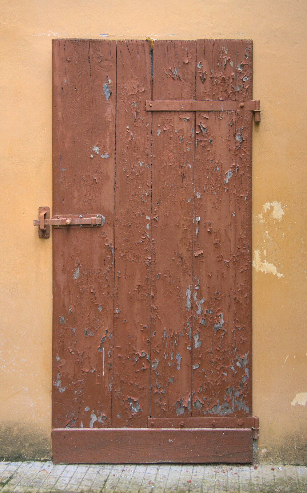 Marconi, Arezzo and the Sagra del Maccherone Festival, Battifolle, Tuscany - 9th June 2013: Peeling paint on a door