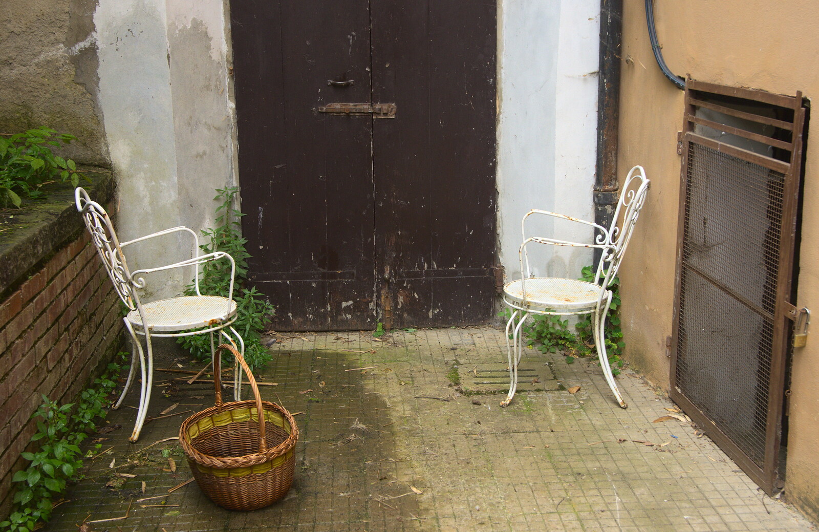 Marconi, Arezzo and the Sagra del Maccherone Festival, Battifolle, Tuscany - 9th June 2013: A pair of distressed garden chairs