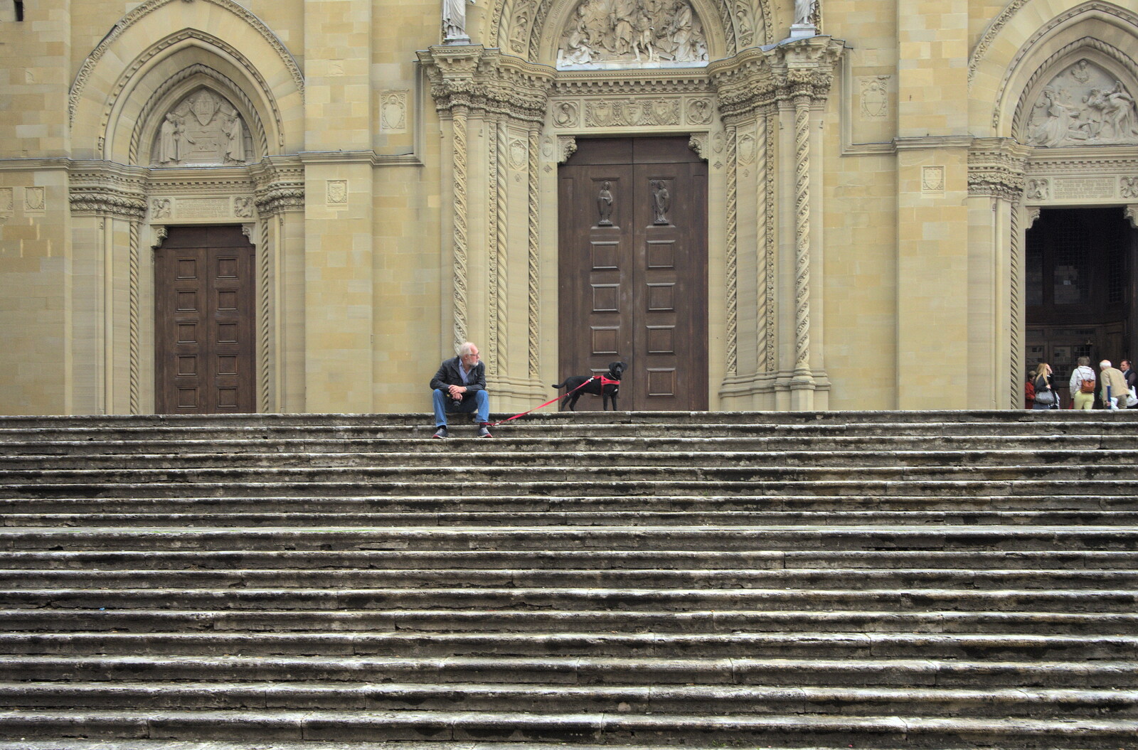 Marconi, Arezzo and the Sagra del Maccherone Festival, Battifolle, Tuscany - 9th June 2013: Old man on the cathedral steps