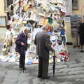 2013 Passers-by inspect the pile of books