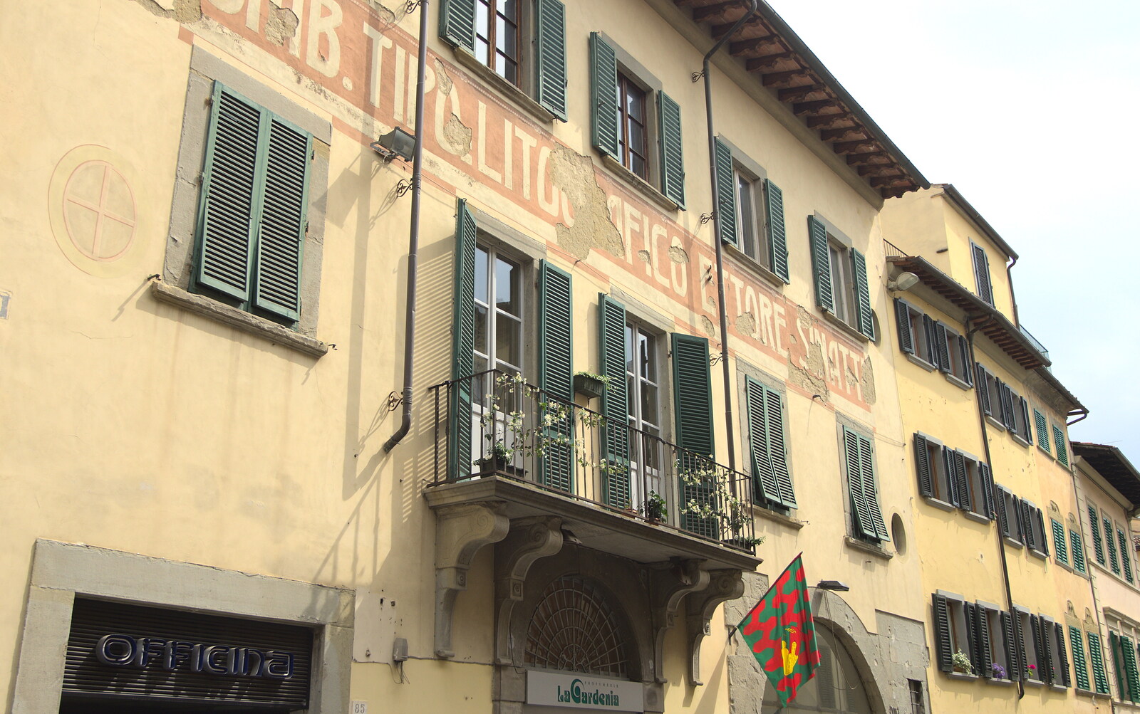 Marconi, Arezzo and the Sagra del Maccherone Festival, Battifolle, Tuscany - 9th June 2013: Crumbling sign on a building