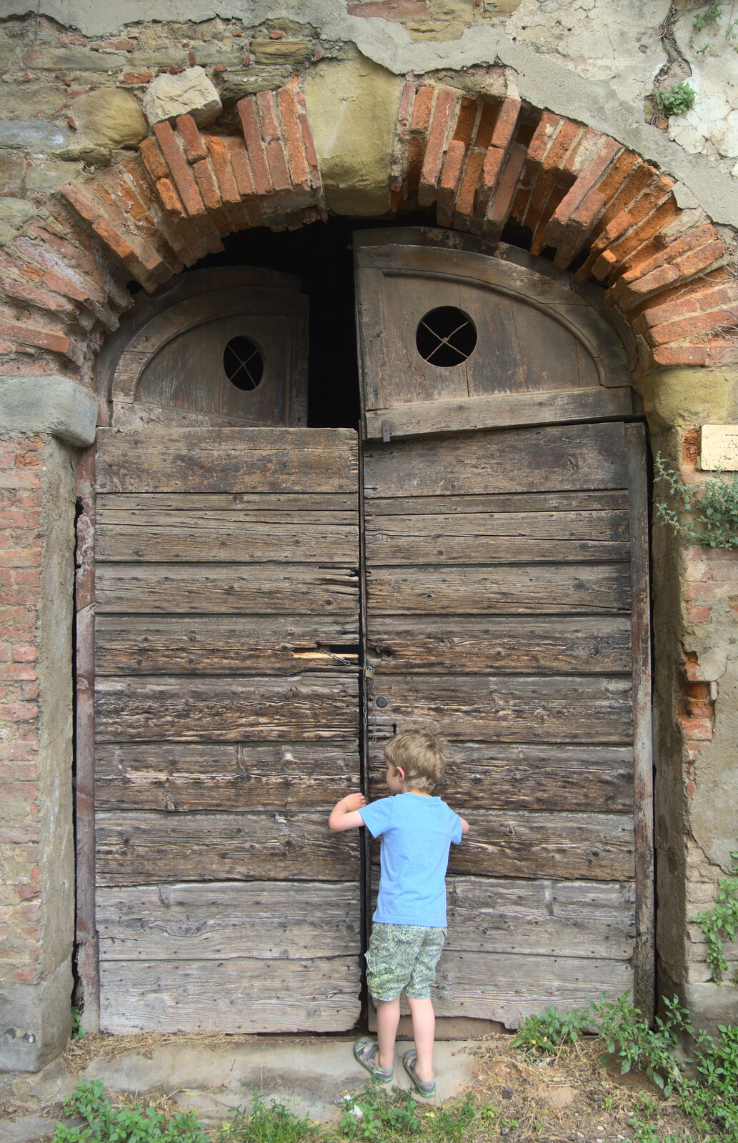 Marconi, Arezzo and the Sagra del Maccherone Festival, Battifolle, Tuscany - 9th June 2013: Fred inspects an old door