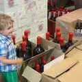 2013 Fred stands next to some huge magnum or jeroboam bottles of wine