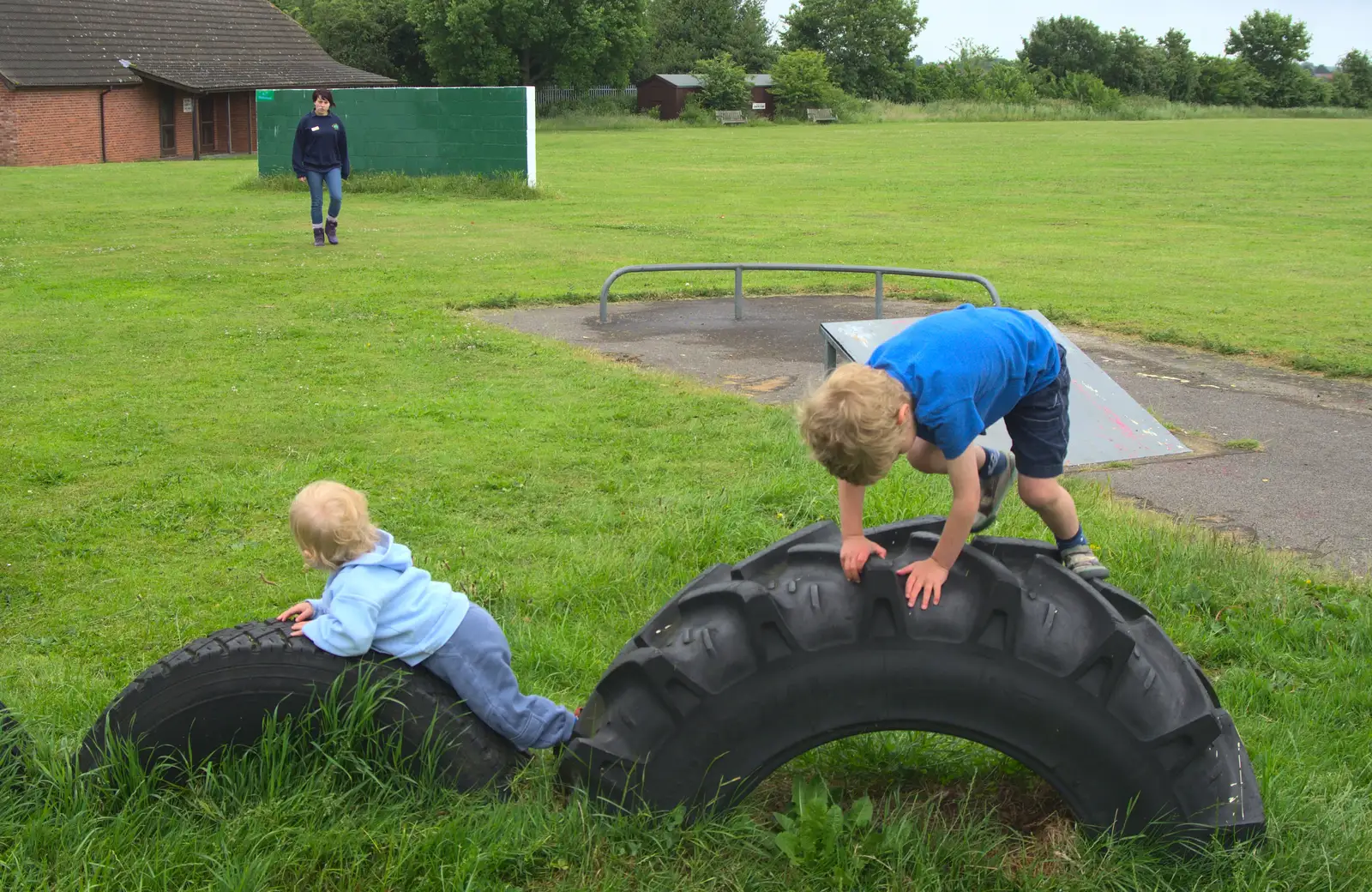 Harry and Fred play on tyres, from Thrandeston Pig Roast and Tractors, Thrandeston Little Green, Suffolk - 23rd June 2013