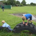 Harry and Fred play on tyres, Thrandeston Pig Roast and Tractors, Thrandeston Little Green, Suffolk - 23rd June 2013