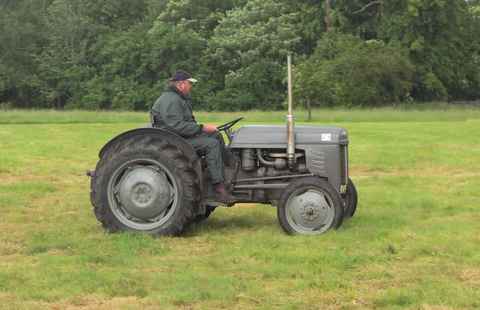 A grey Ferguson trundles onto the green, from Thrandeston Pig Roast and Tractors, Thrandeston Little Green, Suffolk - 23rd June 2013