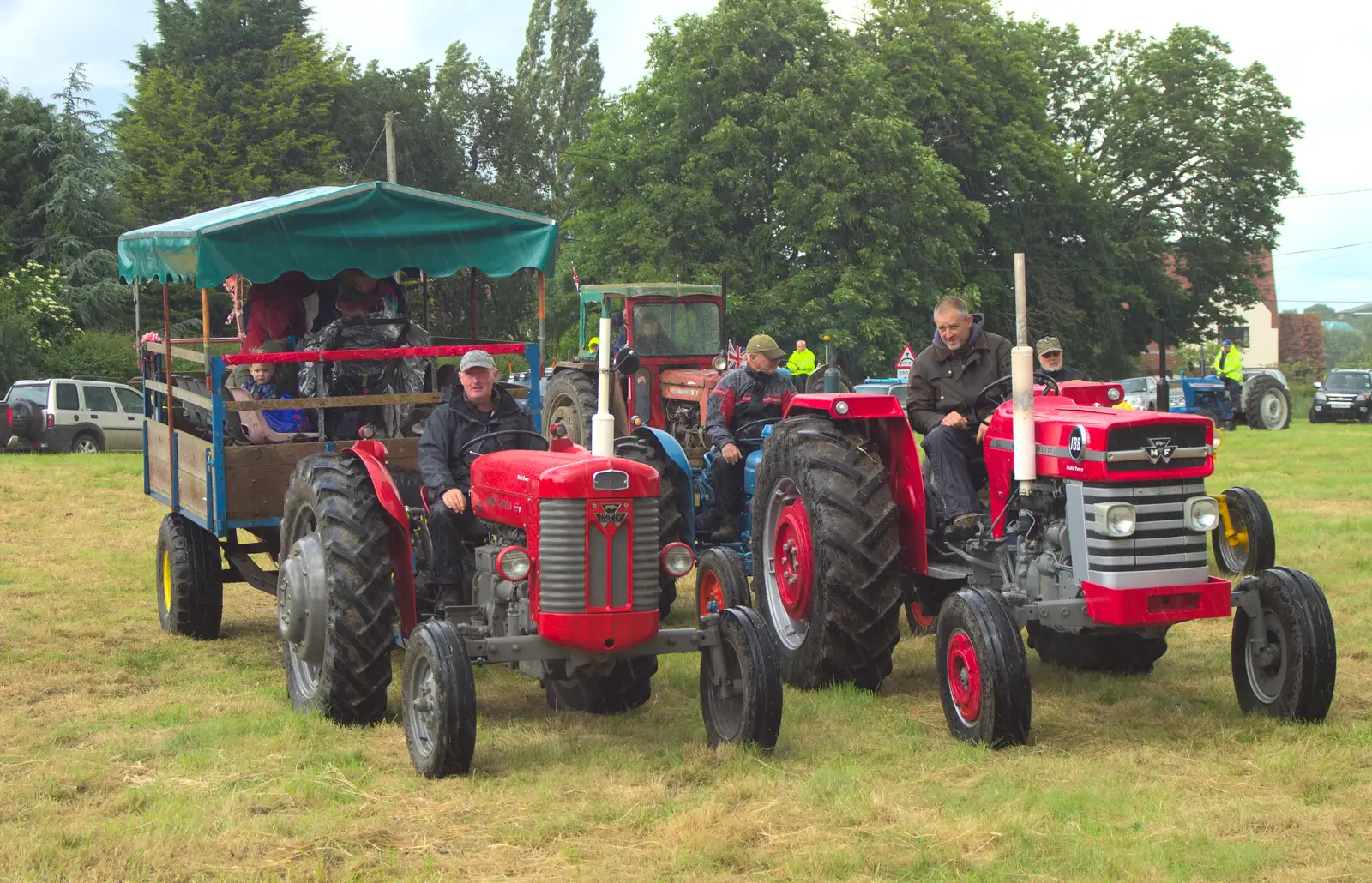 More tractors line up in the rain, from Thrandeston Pig Roast and Tractors, Thrandeston Little Green, Suffolk - 23rd June 2013