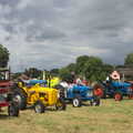 Multi-coloured tractors on the green, Thrandeston Pig Roast and Tractors, Thrandeston Little Green, Suffolk - 23rd June 2013