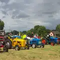 Multi-coloured tractors on the green, Thrandeston Pig Roast and Tractors, Thrandeston Little Green, Suffolk - 23rd June 2013