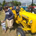Fred has a go on the bright yellow tractor, Thrandeston Pig Roast and Tractors, Thrandeston Little Green, Suffolk - 23rd June 2013