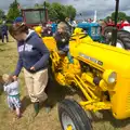 Fred has a go on the bright yellow tractor, Thrandeston Pig Roast and Tractors, Thrandeston Little Green, Suffolk - 23rd June 2013