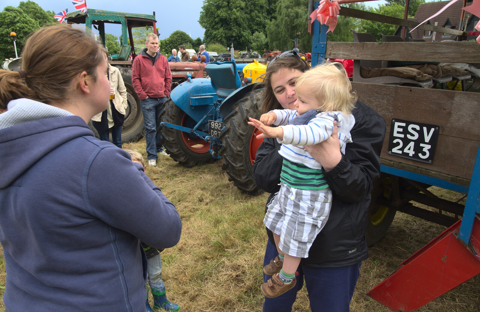 Claire scoops Harry up from Thrandeston Pig Roast and Tractors, Thrandeston Little Green, Suffolk - 23rd June 2013