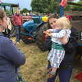 Claire scoops Harry up, Thrandeston Pig Roast and Tractors, Thrandeston Little Green, Suffolk - 23rd June 2013