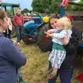 Claire scoops Harry up, Thrandeston Pig Roast and Tractors, Thrandeston Little Green, Suffolk - 23rd June 2013