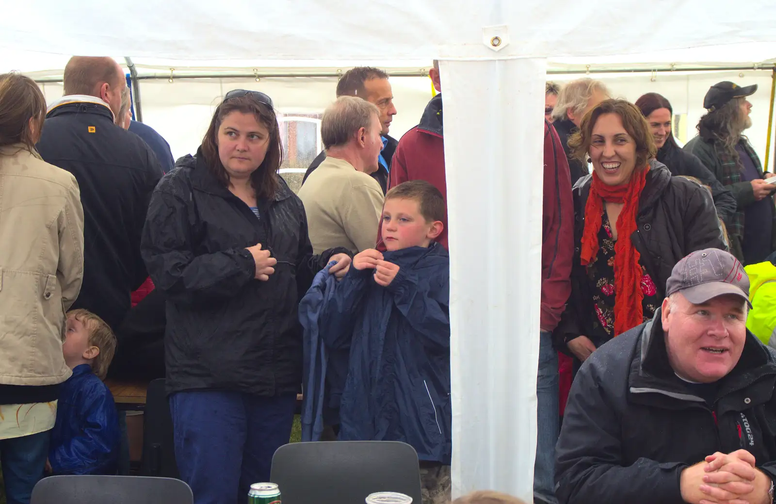 Claire and Matthew hide from the rain, from Thrandeston Pig Roast and Tractors, Thrandeston Little Green, Suffolk - 23rd June 2013