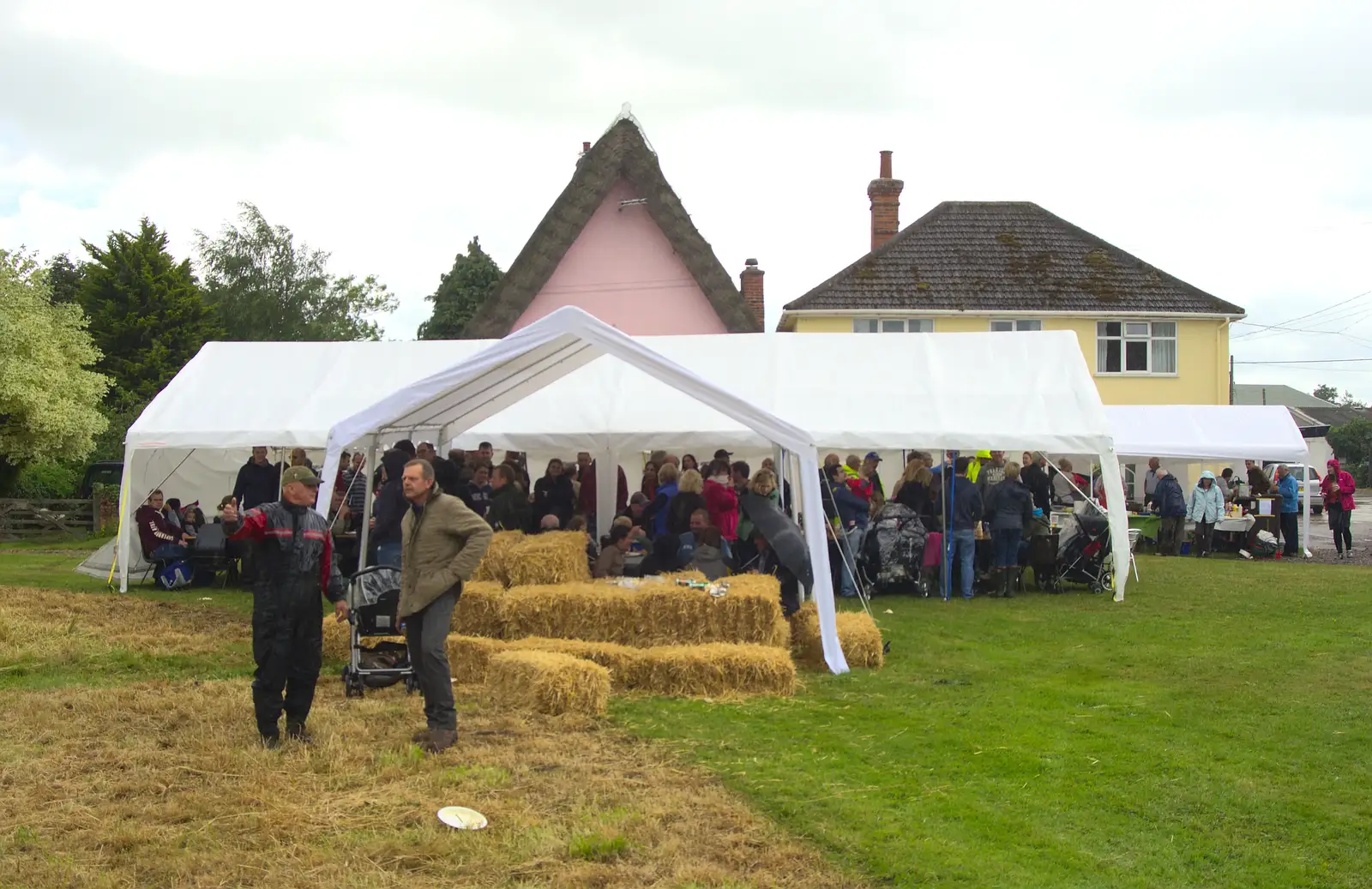 Everyone crowds under the marquee, from Thrandeston Pig Roast and Tractors, Thrandeston Little Green, Suffolk - 23rd June 2013