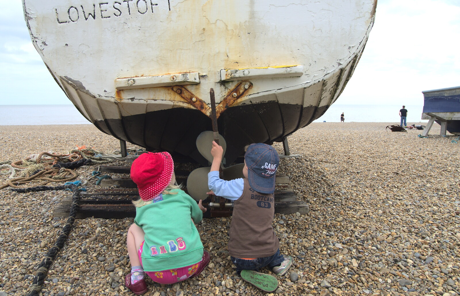 Grace and Fred explore boats on the beach from Petrol Station Destruction, and a Cliff House Camping Trip, Southwark and Dunwich, Suffolk - 30th June 2013
