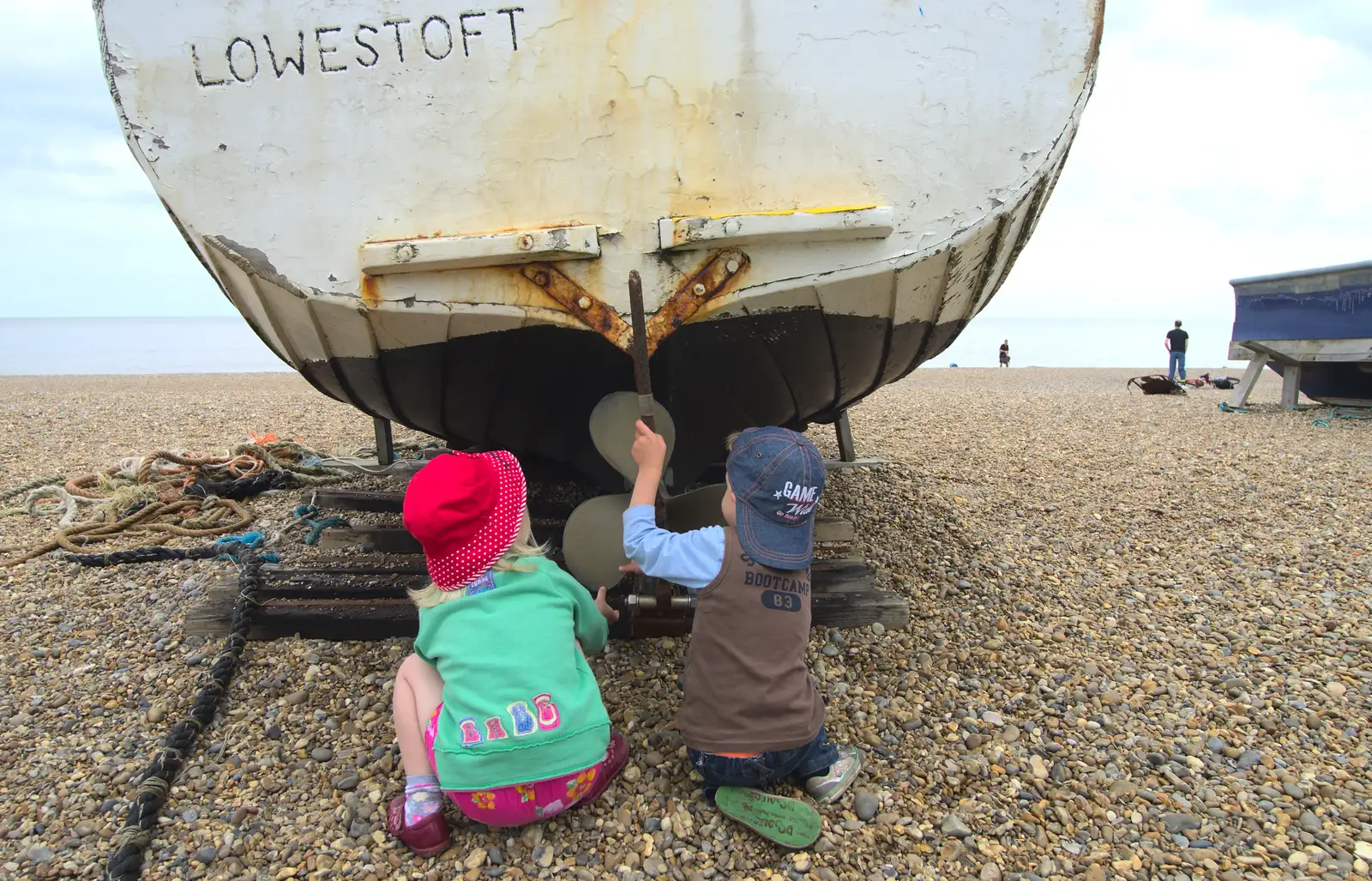 Grace and Fred explore boats on the beach, from Petrol Station Destruction, and a Cliff House Camping Trip, Southwark and Dunwich, Suffolk - 30th June 2013