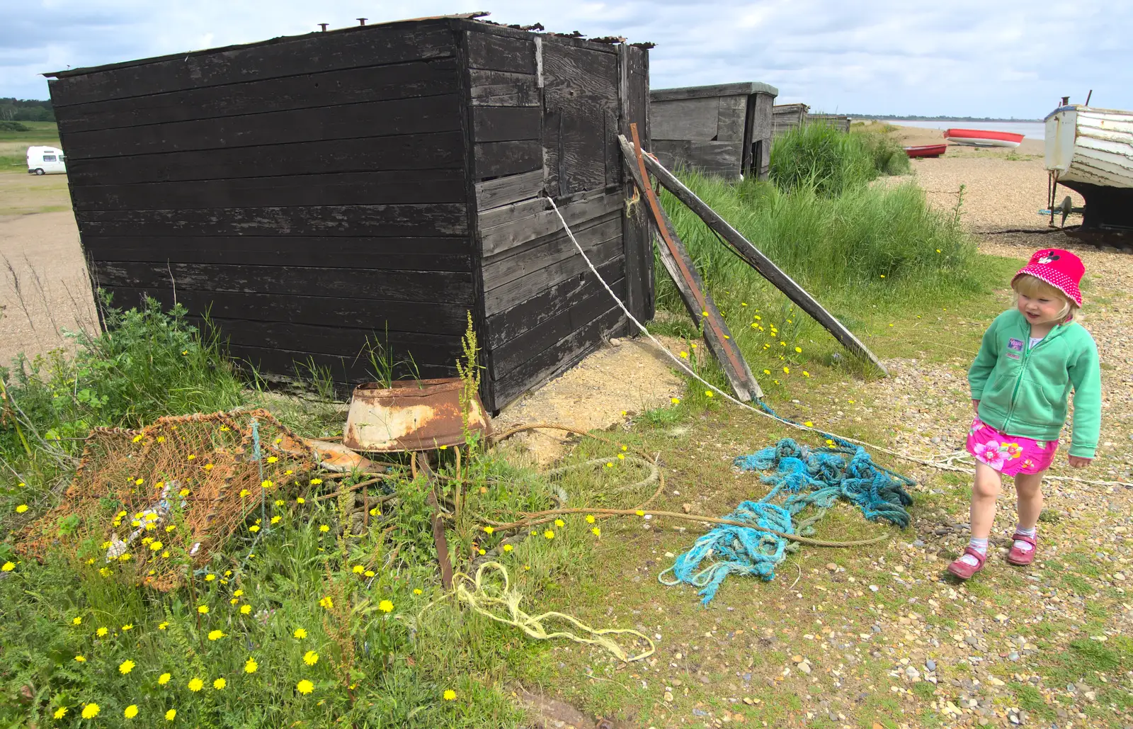 Grace walks past an old hut on the beach, from Petrol Station Destruction, and a Cliff House Camping Trip, Southwark and Dunwich, Suffolk - 30th June 2013