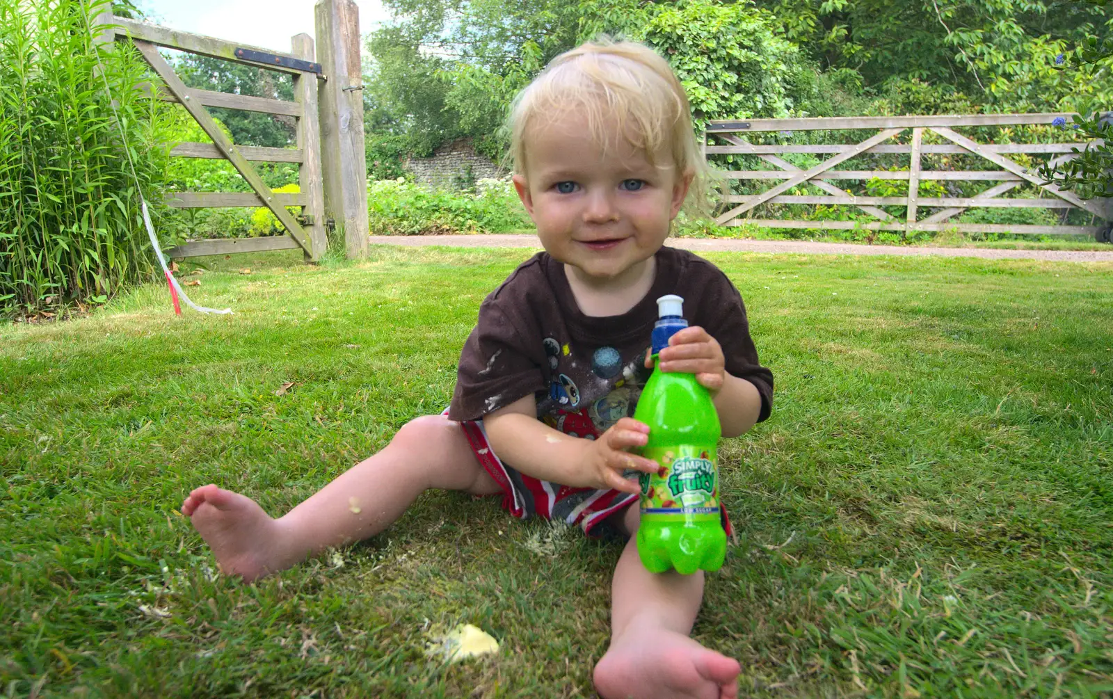 Harry's got a bottle of fruit juice, from Marconi's Demolition and Brome Village Fete, Chelmsford and Brome, Suffolk - 6th July 2013