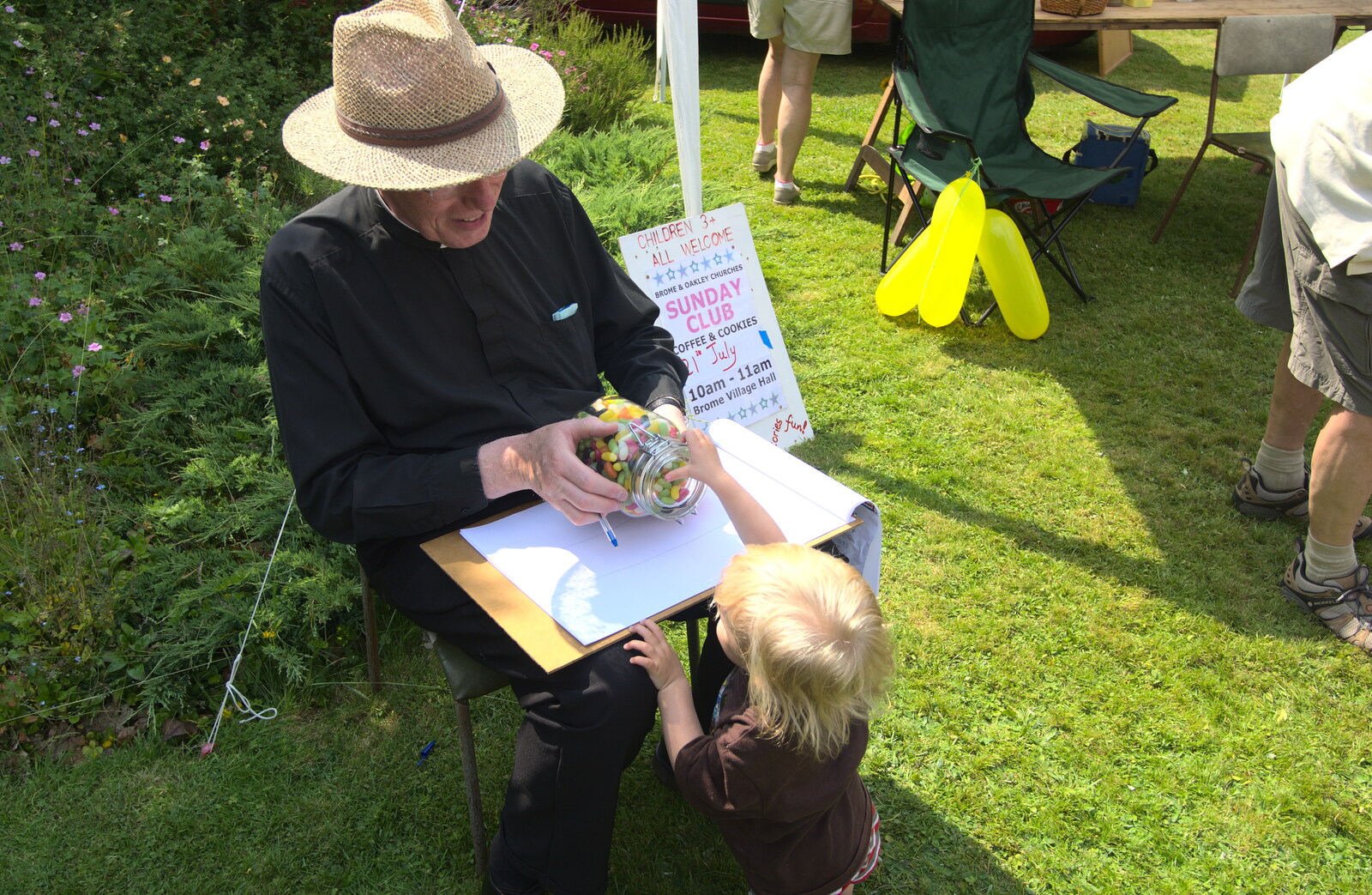 Father Michael tempts Harry with a jar of sweets from Marconi's Demolition and Brome Village Fete, Chelmsford and Brome, Suffolk - 6th July 2013