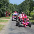 More tractors pass the phone box, The "Pink Ladies" Tractor Run and Barbeque, Thorpe Abbots, Norfolk - 7th July 2013