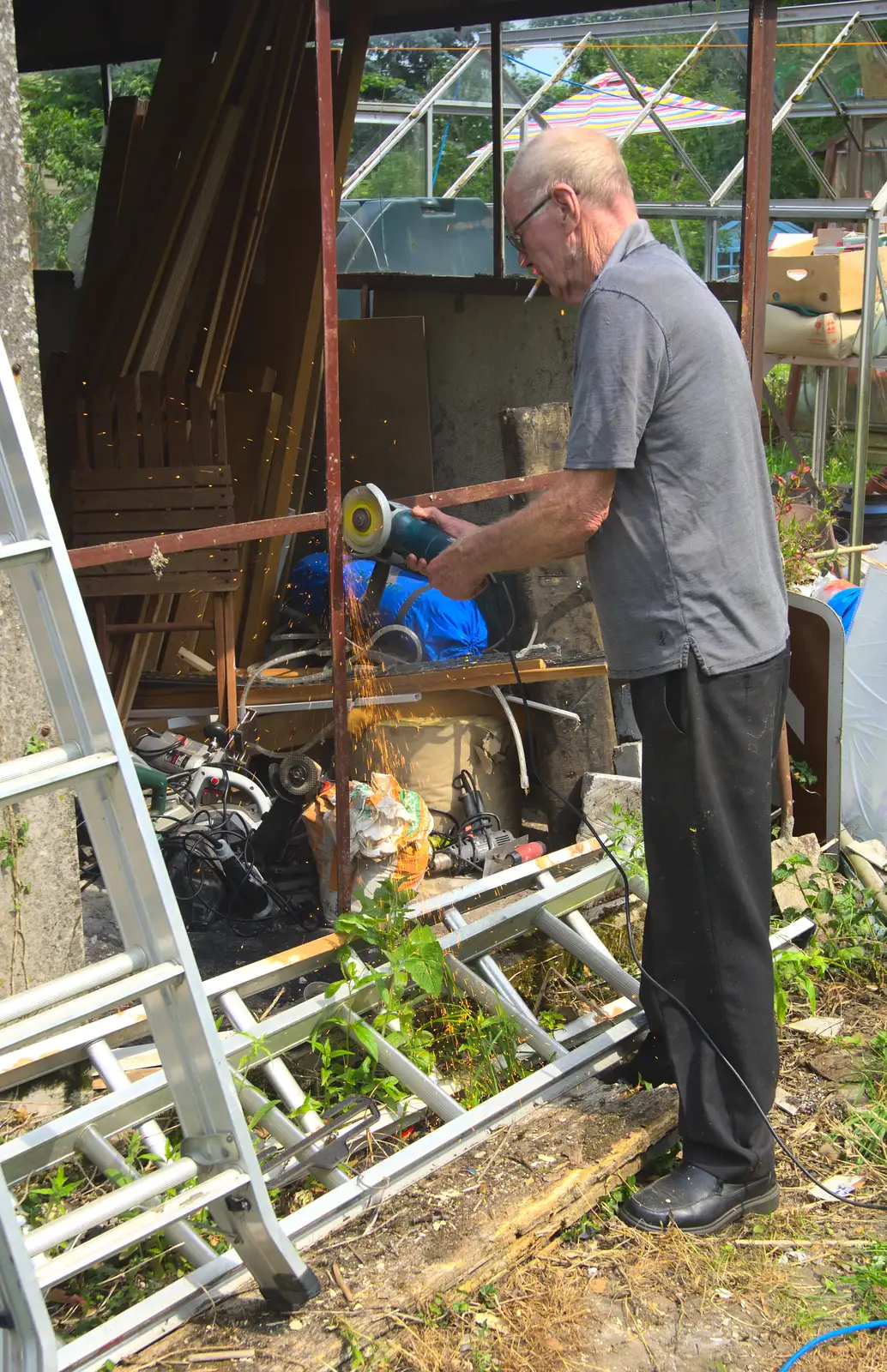 Grandad grinds up the old garage, from The BSCC at Pulham Crown, and Grandad with a Grinder, Brome, Suffolk - 11th July 2013