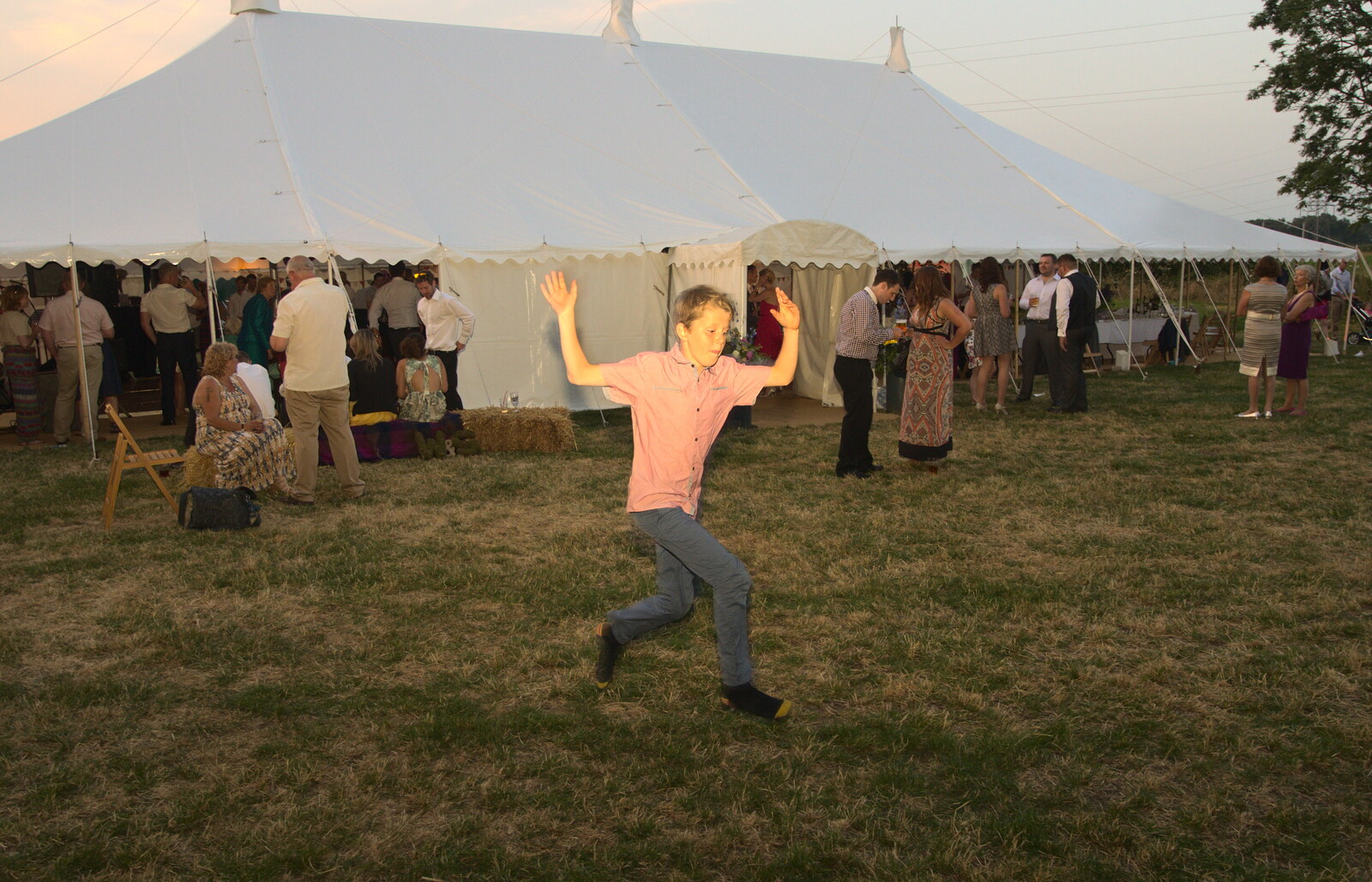 A small boy runs past and leaps in to the air from The BBs Play Steph's Wedding, Burston, Norfolk - 13th July 2013