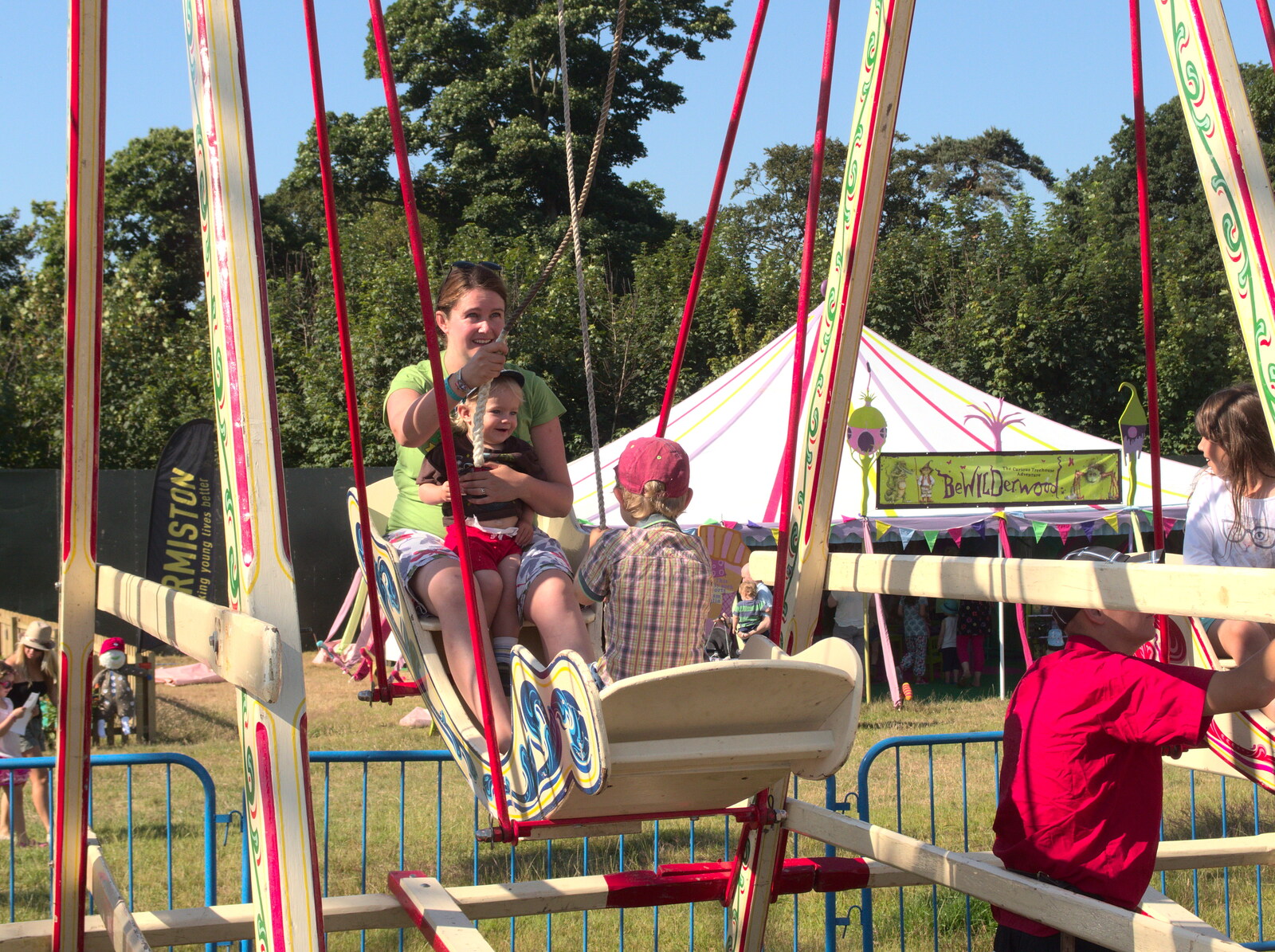 Isobel, Harry and Fred ride on the swing boats from The 8th Latitude Festival, Henham Park, Southwold, Suffolk - 18th July 2013