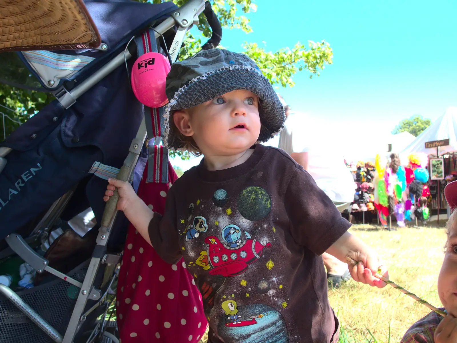 Harry hangs on to the buggy, from The 8th Latitude Festival, Henham Park, Southwold, Suffolk - 18th July 2013