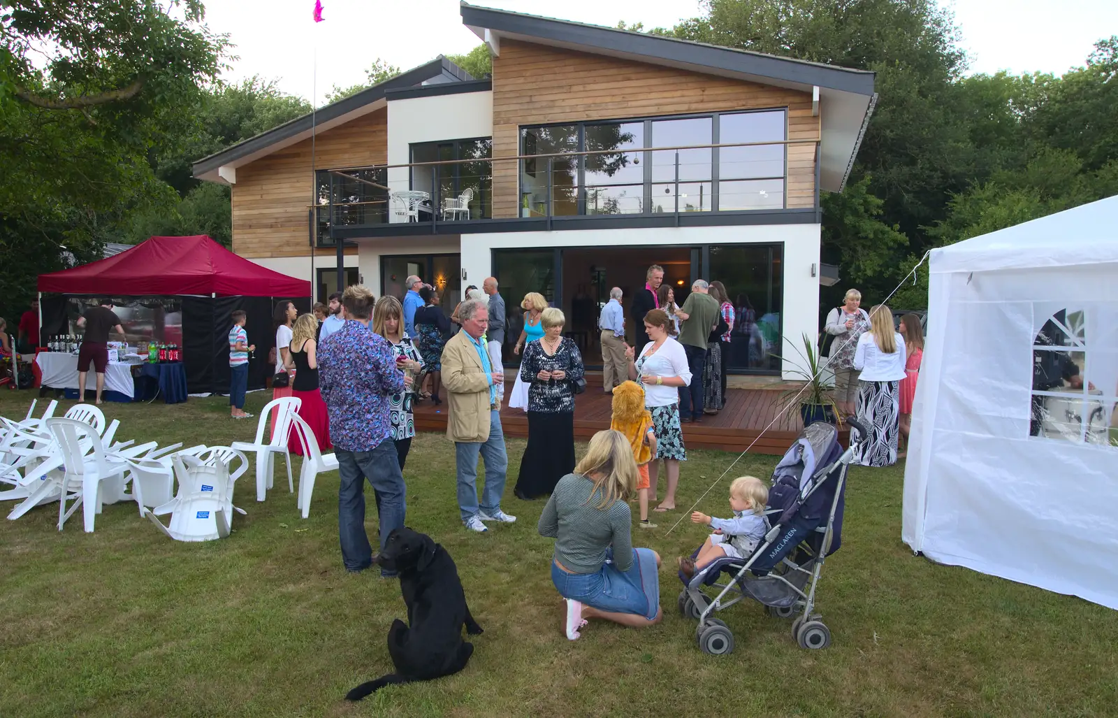 A black labrador roams around, from Henry's 60th Birthday, Hethel, Norfolk - 3rd August 2013