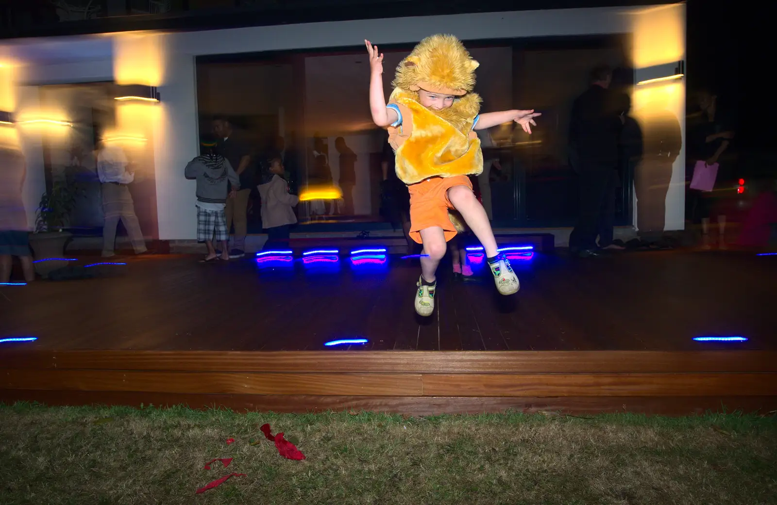 Fred leaps off the decking, from Henry's 60th Birthday, Hethel, Norfolk - 3rd August 2013