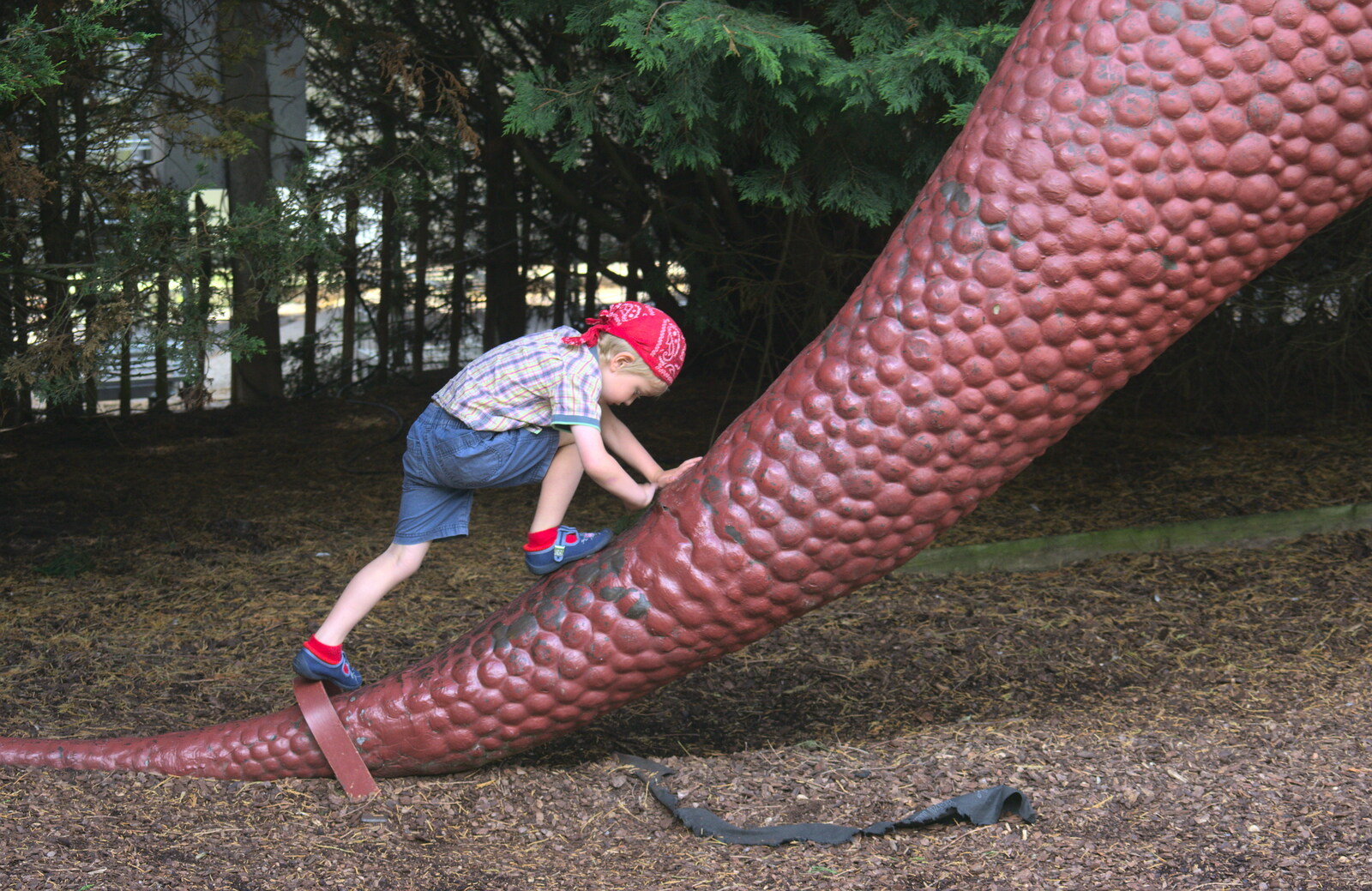 Fred climbs up the tail of a Tyrannosaurus Rex from Tiger Cubs at Banham Zoo, Banham, Norfolk - 6th August 2013