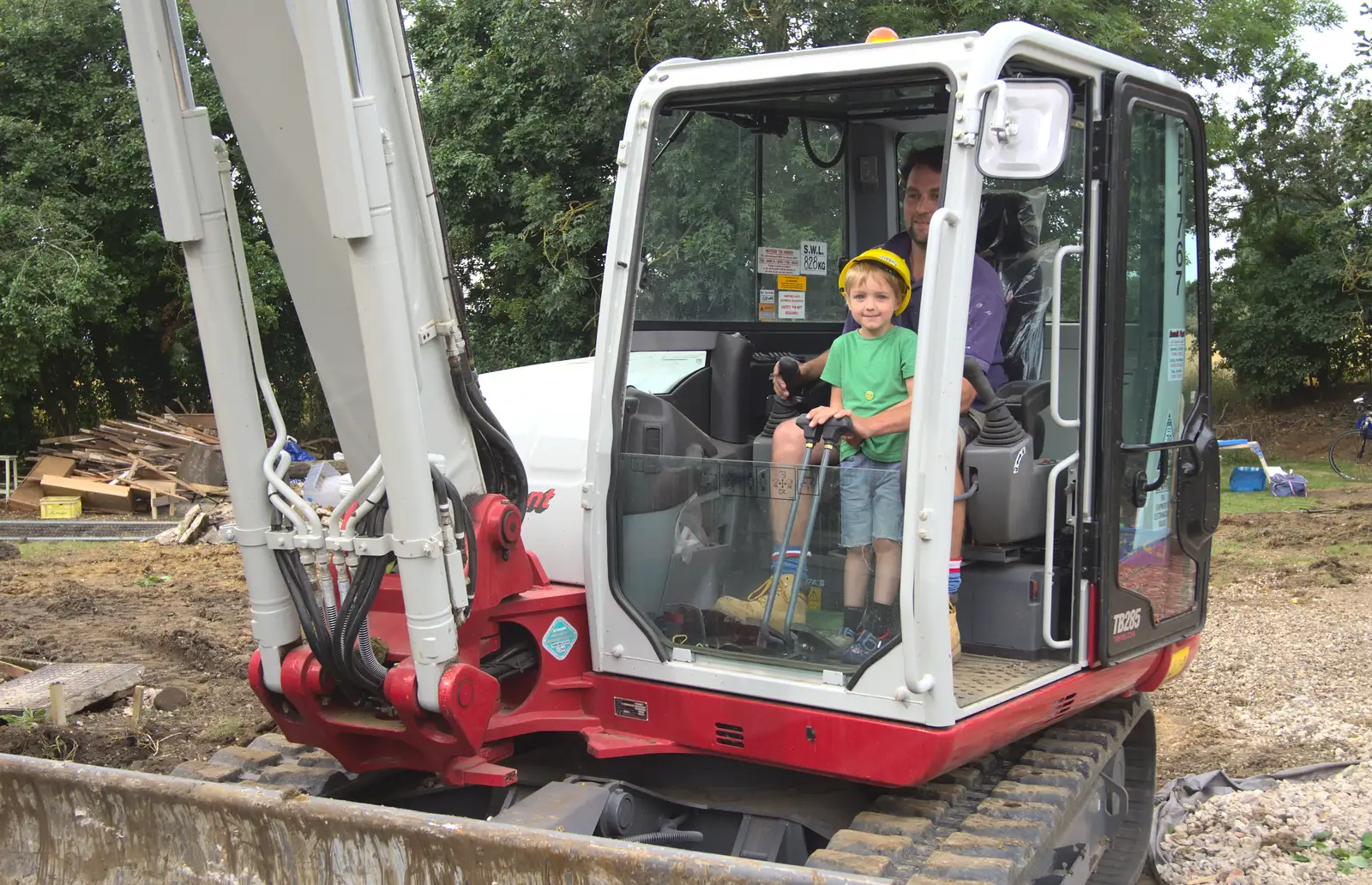 Fred gets a go on the digger, from Grand Designs: Building Commences, Brome, Suffolk - 8th August 2013