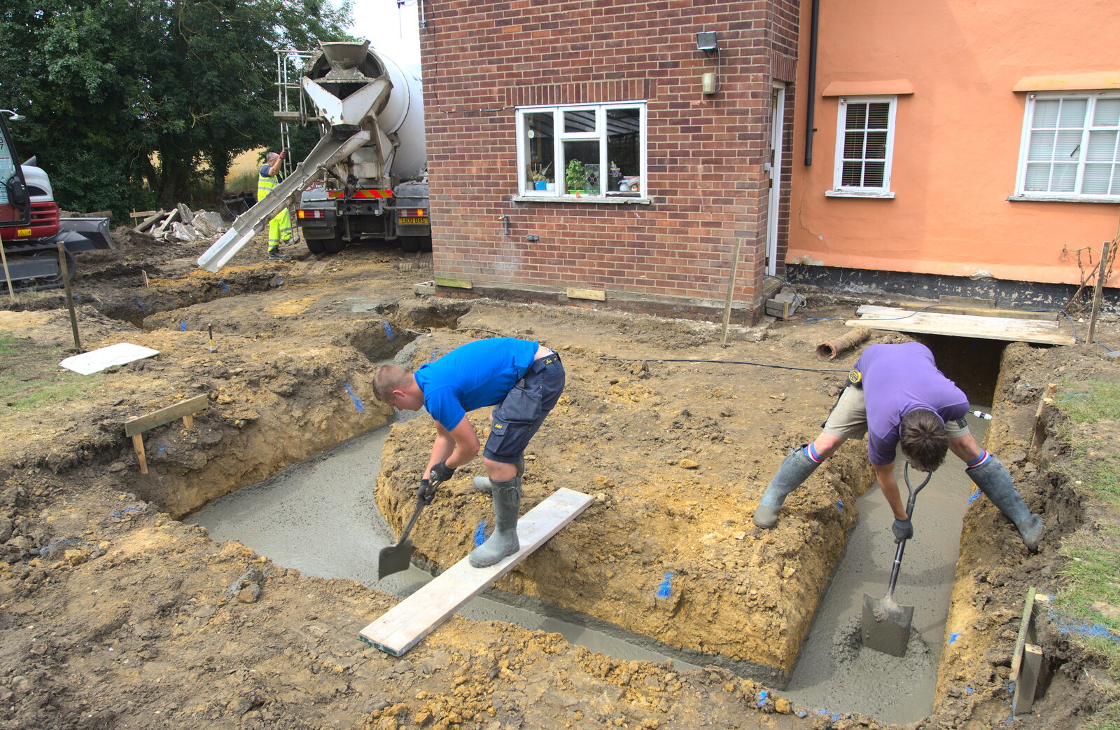 Lewis and Brian help the concrete on its way from Grand Designs: Building Commences, Brome, Suffolk - 8th August 2013