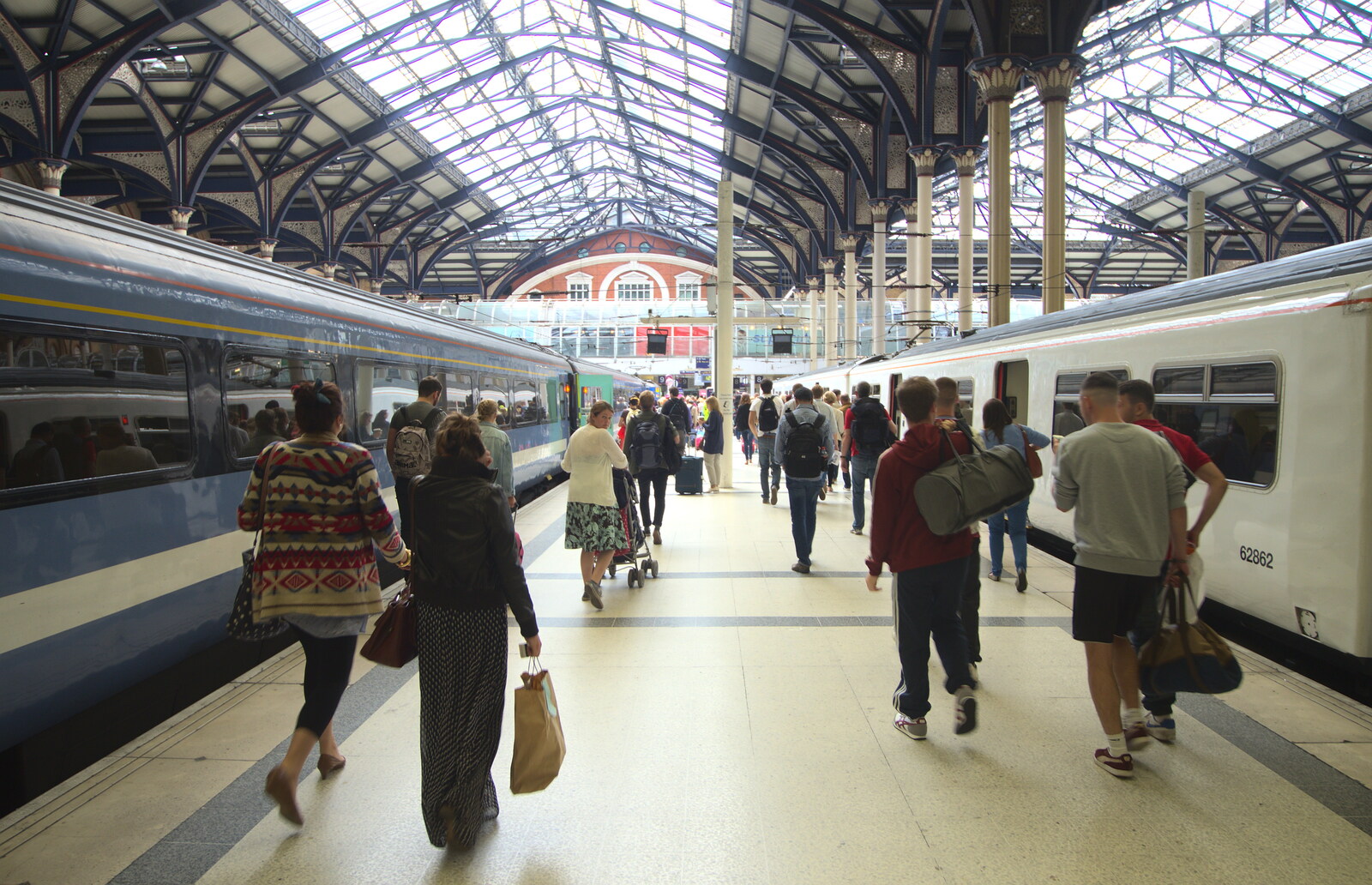 Passengers pile off the train on platform 9 from Spitalfields and Brick Lane Street Art, Whitechapel, London - 10th August 2013