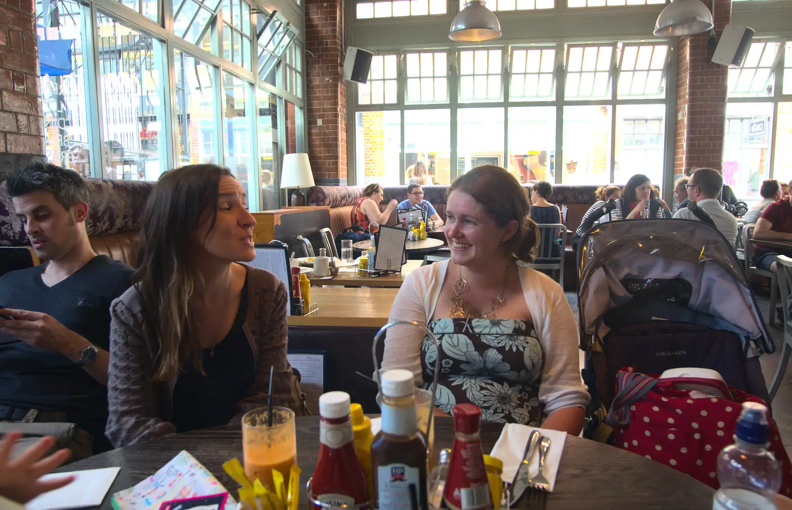 Caoimhe and Isobel chat in Luxe restaurant, from Spitalfields and Brick Lane Street Art, Whitechapel, London - 10th August 2013