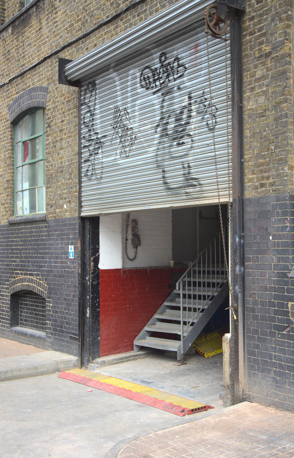 A graffitoed roller shutter from Spitalfields and Brick Lane Street Art, Whitechapel, London - 10th August 2013