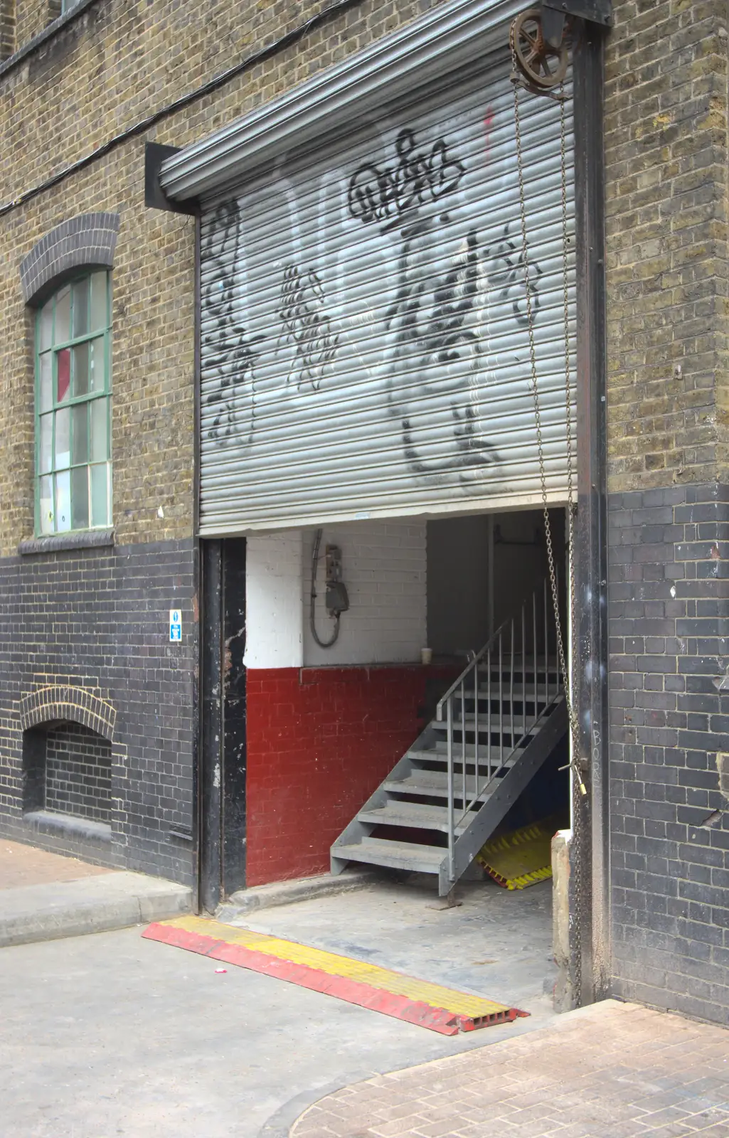 A graffitoed roller shutter, from Spitalfields and Brick Lane Street Art, Whitechapel, London - 10th August 2013