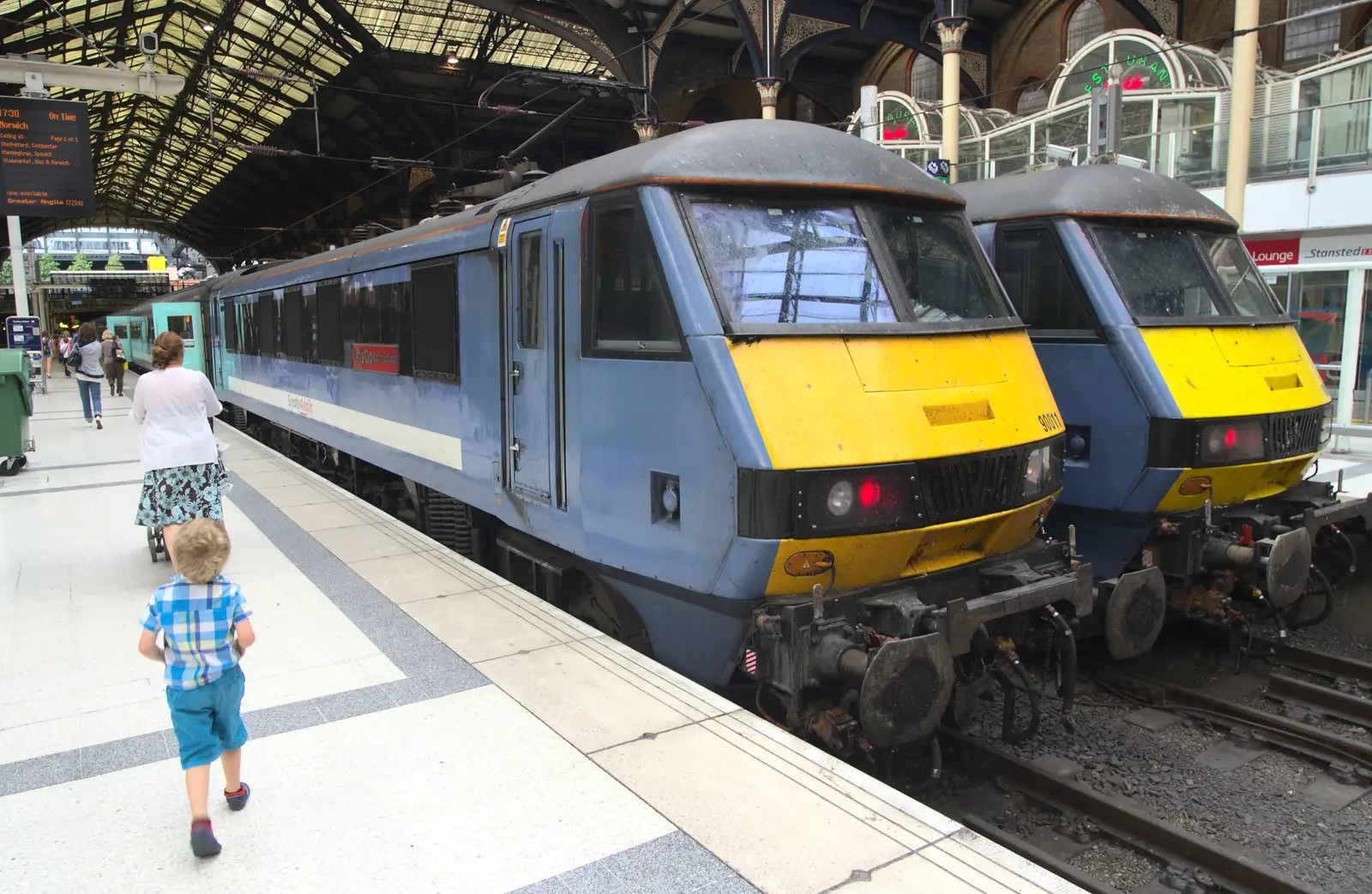 Fred walks past a pair of Class 90 locos, from Spitalfields and Brick Lane Street Art, Whitechapel, London - 10th August 2013