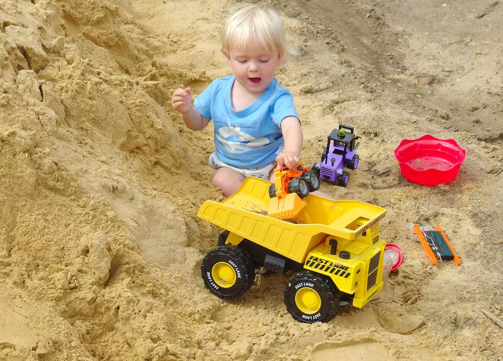 Harry fills a dumper truck up, from A Giant Sand Pile, and a Walk at Thornham, Suffolk - 17th August 2013