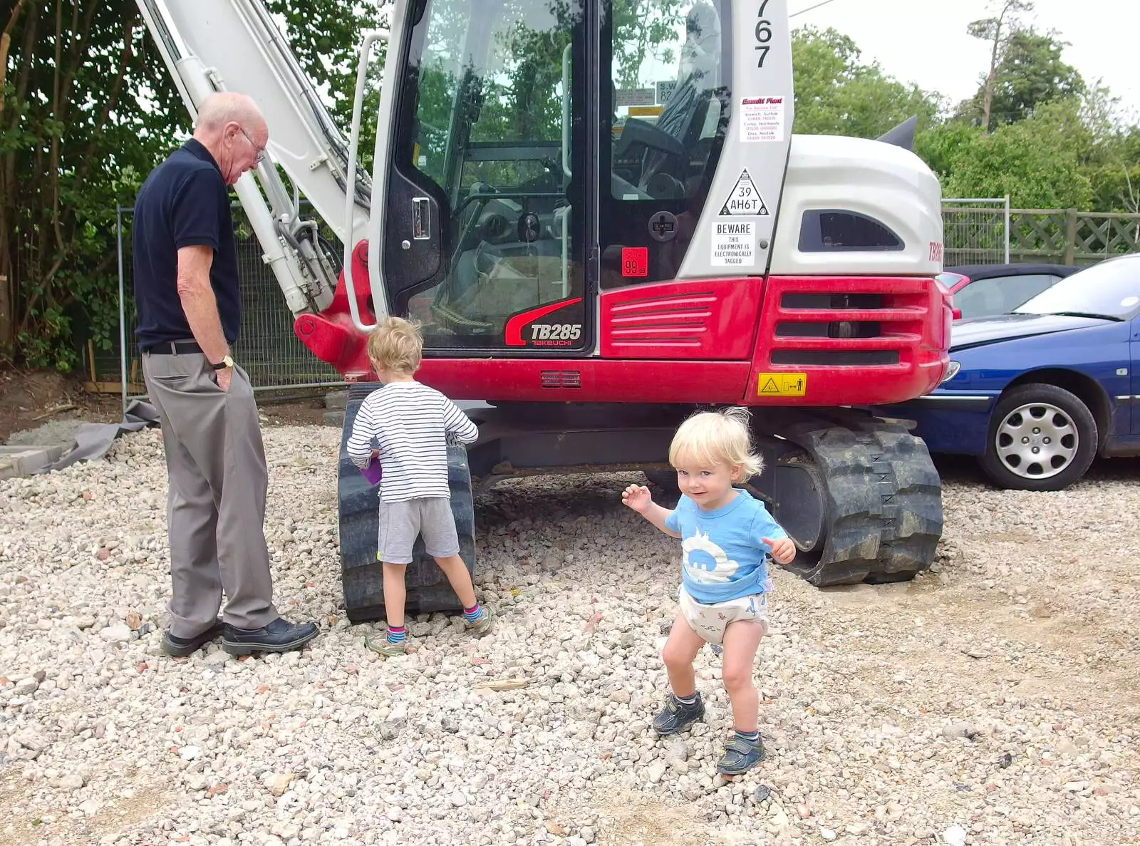 Harry looks cheeky as Grandad and Fred inspect, from A Giant Sand Pile, and a Walk at Thornham, Suffolk - 17th August 2013