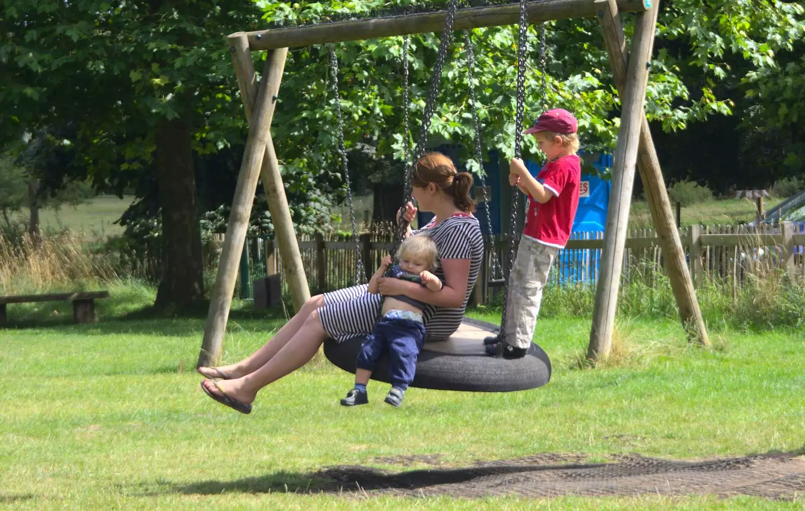 The gang on a tyre swing, from A Giant Sand Pile, and a Walk at Thornham, Suffolk - 17th August 2013