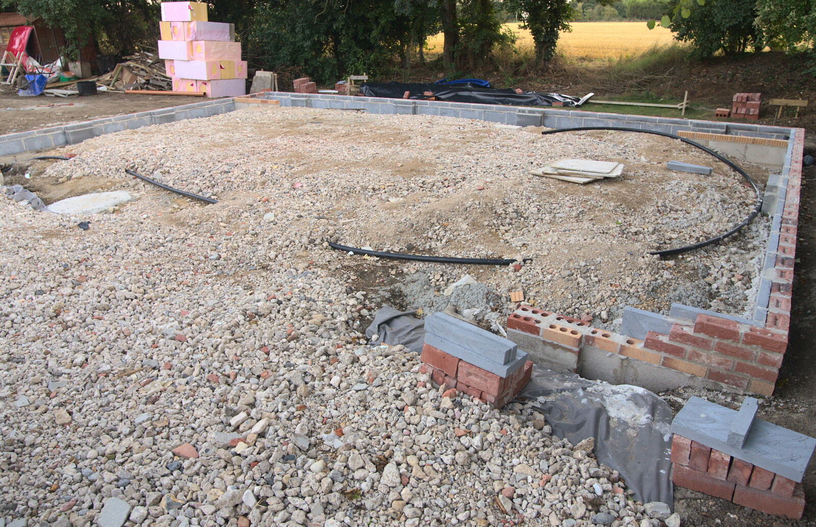 The brick bas of the garage appears from Bressingham Gardens, and Building Progress, Brome, Suffolk - 26th August 2013