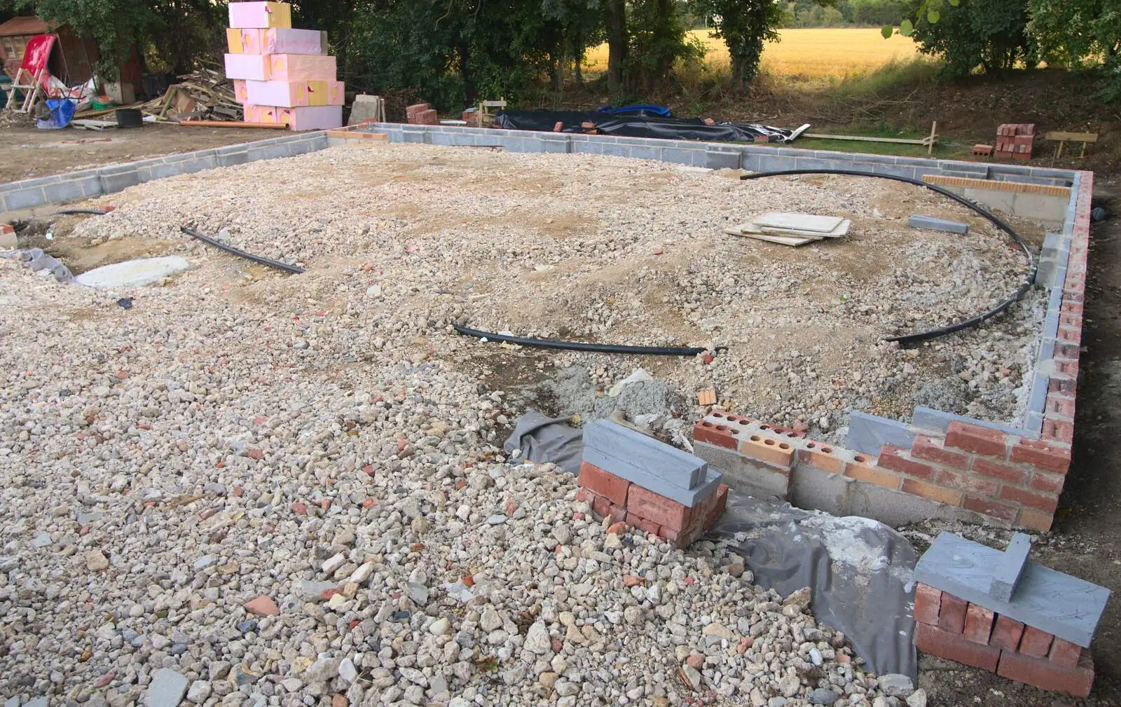 The brick base of the new garage appears, from Bressingham Gardens, and Building Progress, Brome, Suffolk - 26th August 2013