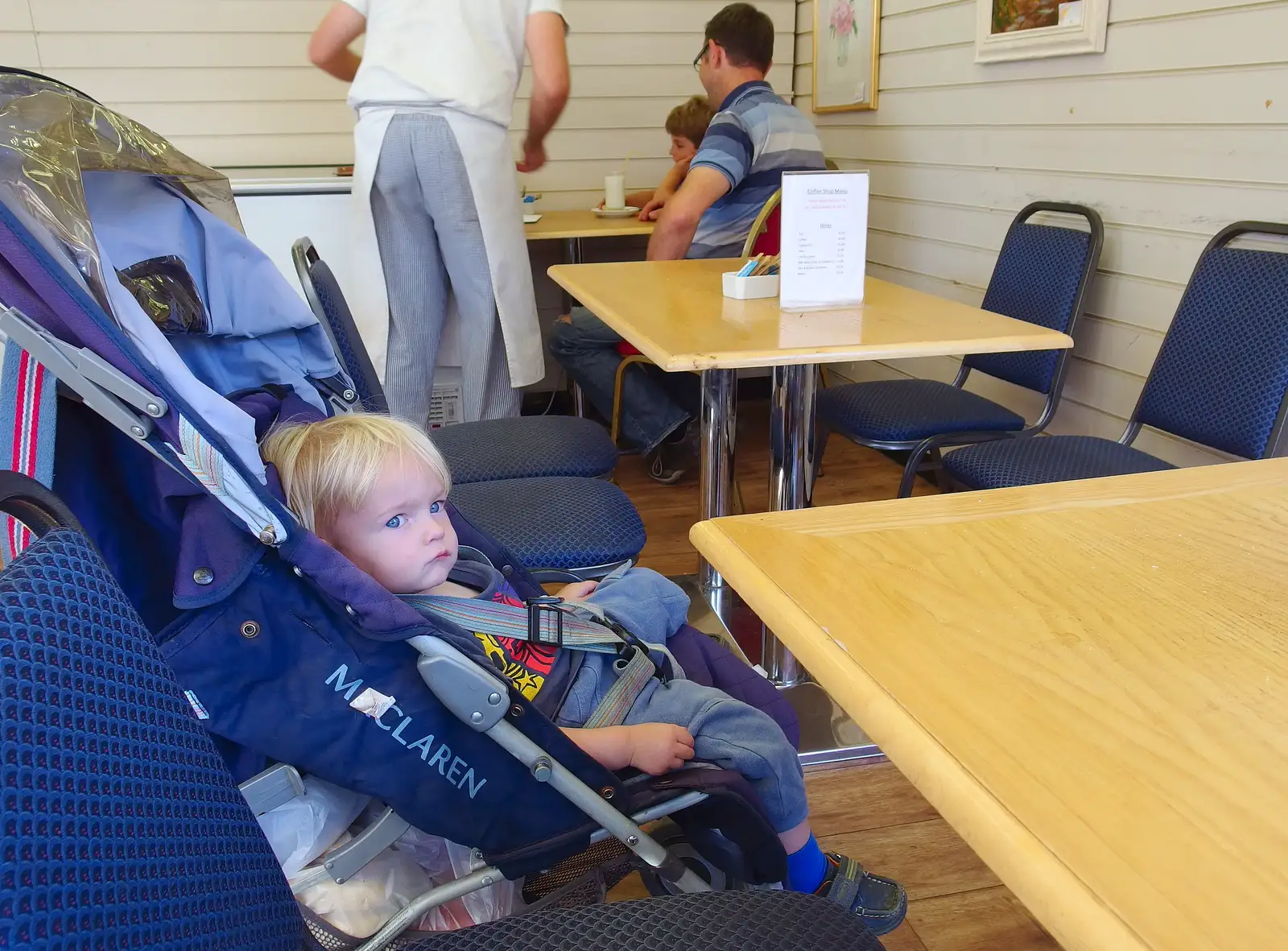 Harry waits for something to eat in a Café, from Pigeon-Eating Hawks and the Mellis Beer Festival, London and Suffolk - 31st August 2013