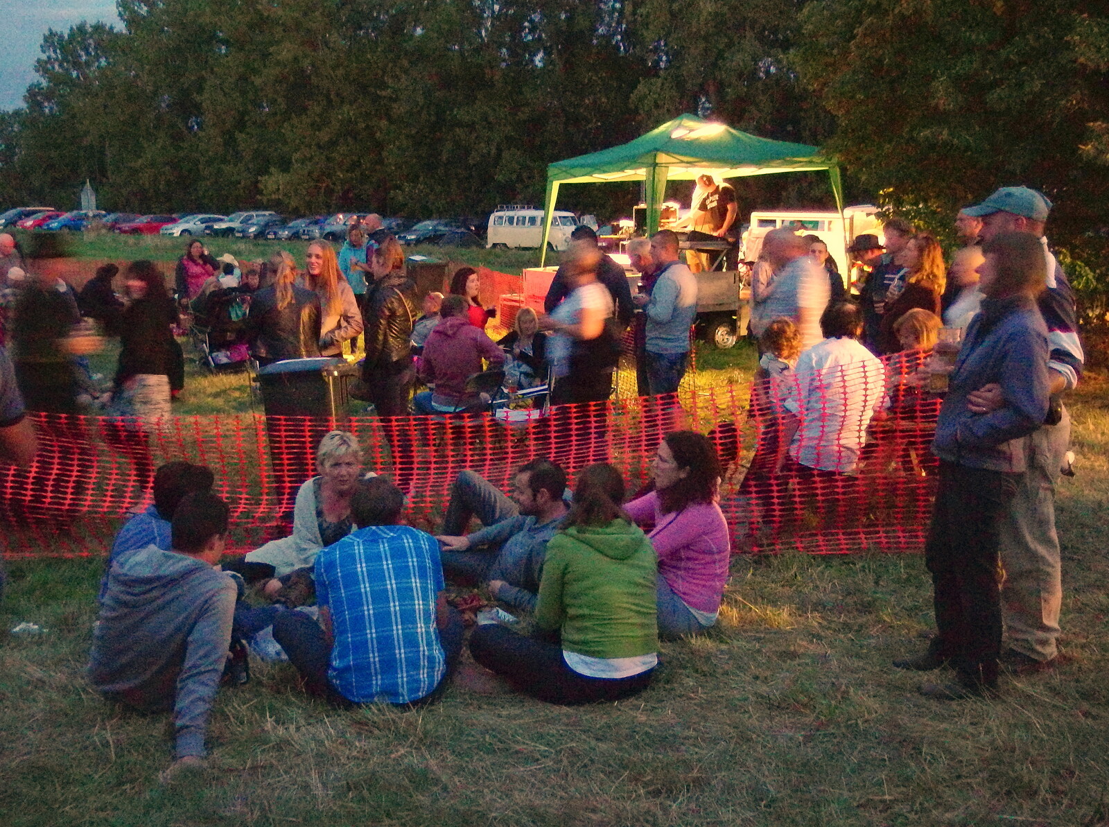 Crowds sit around in the gathering dusk in Mellis from Pigeon-Eating Hawks and the Mellis Beer Festival, London and Suffolk - 31st August 2013