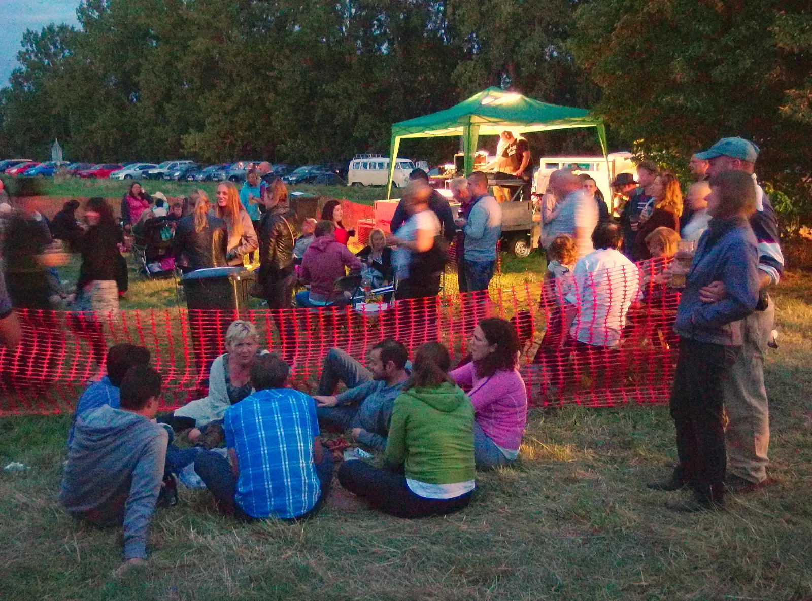 Crowds sit around in the gathering dusk in Mellis, from Pigeon-Eating Hawks and the Mellis Beer Festival, London and Suffolk - 31st August 2013