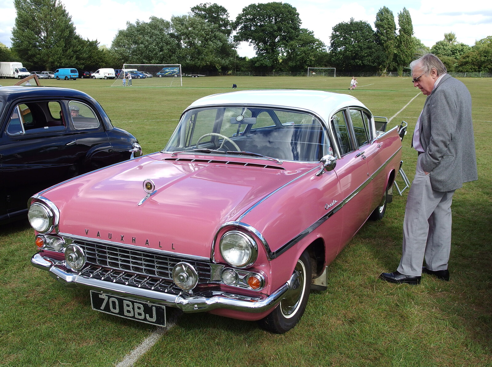 A pink 1950s Vauxhall is inspected from Stradbroke Classic Car Show, Stradbroke, Suffolk - 7th September 2013