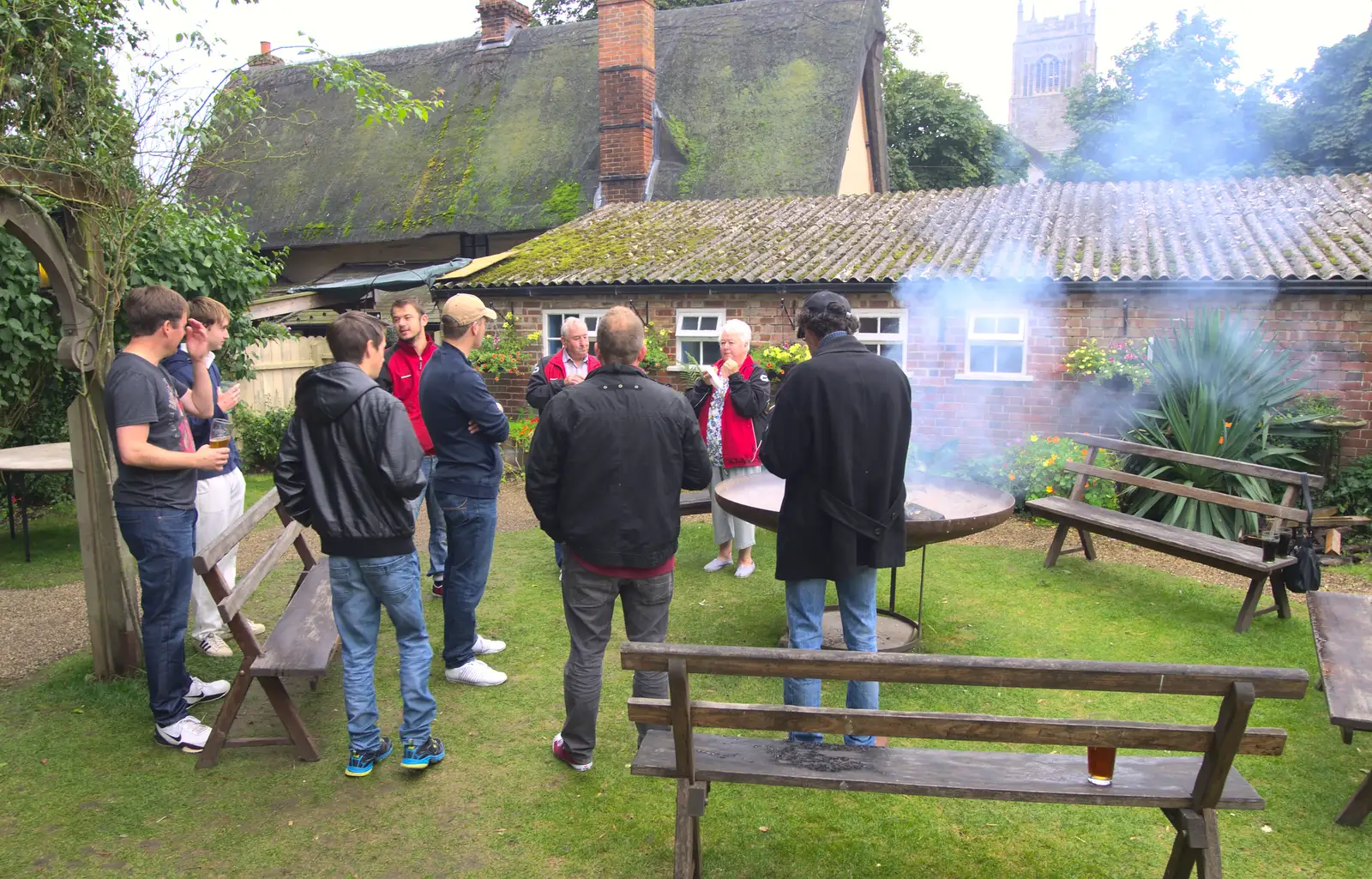 People crowd around the fire pit, from The Low House Beer Festival, Laxfield, Suffolk - 15th September 2013